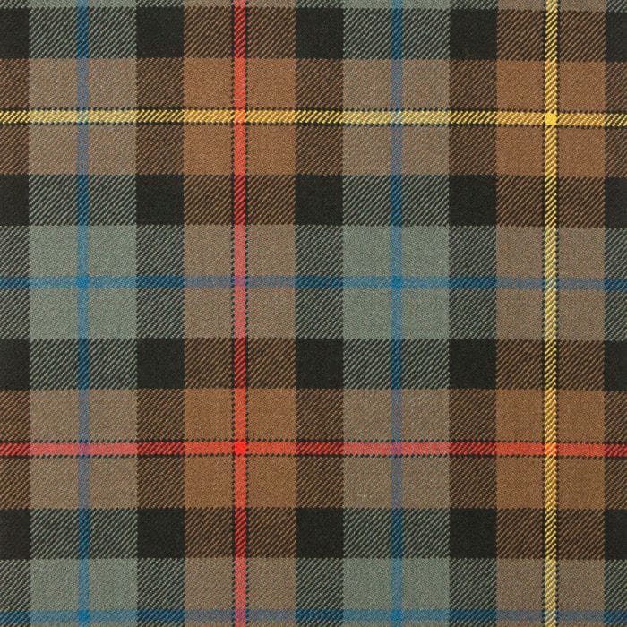 Smith Weathered Tartan Fabric features muted earth tones and faded blues, giving it a rustic, vintage look inspired by Scottish heritage.